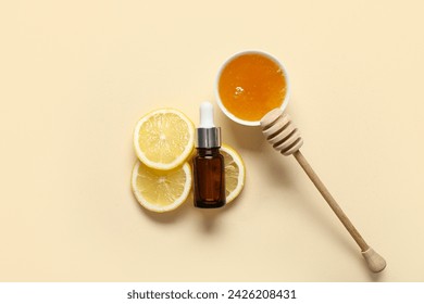 Composition with bottle of essential oil, honey and fresh lemon on color background - Powered by Shutterstock