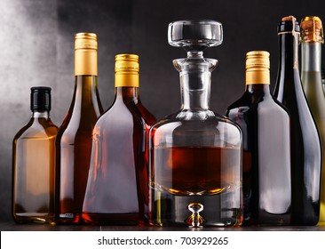 Composition with bottles of assorted alcoholic beverages. - Shutterstock ID 703929265