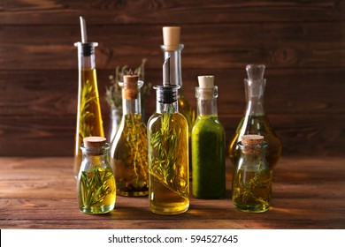 Composition of bottles with oil on wooden background - Powered by Shutterstock