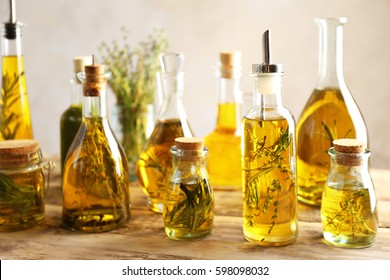Composition of bottles with oil on wooden table - Powered by Shutterstock