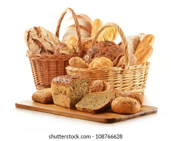 Composition With Bread And Rolls In Wicker Basket Isolated On White. Cereal Products.