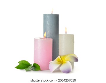 Composition With Burning Candles, Leaves And Plumeria Flower On White Background