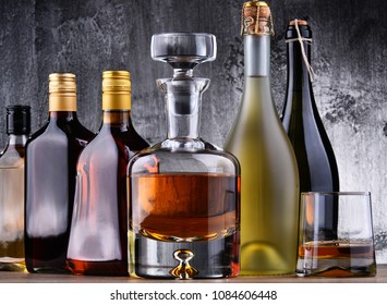 Composition with carafe and bottles of assorted alcoholic beverages. - Shutterstock ID 1084606448