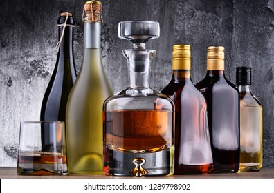 Composition with carafe and bottles of assorted alcoholic beverages. - Shutterstock ID 1289798902