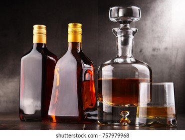 Composition with carafe and bottles of assorted alcoholic beverages. - Shutterstock ID 757979968
