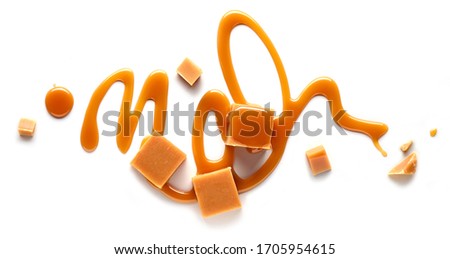 composition of caramel candies isolated on white background, top view