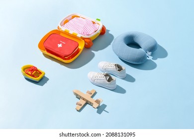 Composition Of Child Accessories And First Aid Kit On Color Background. Travel Concept