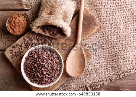 Composition with cocoa nibs on table