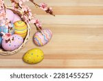 Composition with colored Easter eggs on wood background