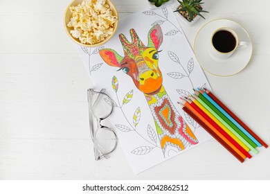 Composition with coloring picture on light wooden background - Powered by Shutterstock