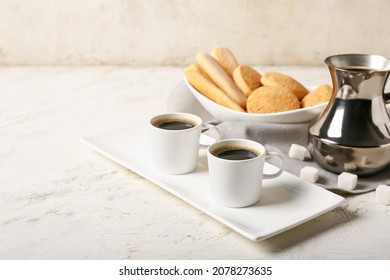 Composition With Cups Of Tasty Coffee And Cookies On Light Background