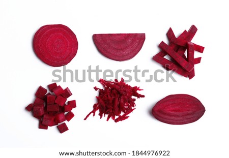 Composition with cut raw beets on white background, top view