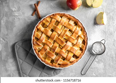 Composition with delicious apple pie on light background