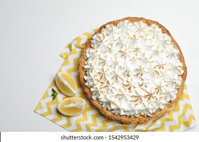 Composition With Delicious Lemon Meringue Pie On White Table, Top View