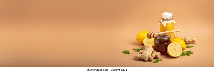 Composition with detox drink, sea buckthorn berries, lemons, mint, ginger, honey in glass jar. Food for immunity stimulation and against flu. Healthy natural remedies to boost immune system - Powered by Shutterstock