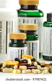Composition with dietary supplement capsules and containers. Variety of drug pills
