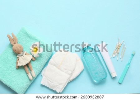 Composition with different bath accessories and toy for baby on color background
