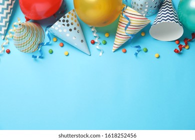 Composition With Different Birthday Accessories On Blue Background, Space For Text