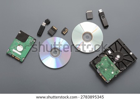 Composition with different memory storage devices on grey background