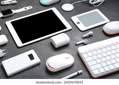 Composition with different modern devices on dark background