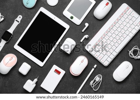 Composition with different modern devices on dark background