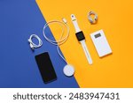 Composition with different modern gadgets on color background