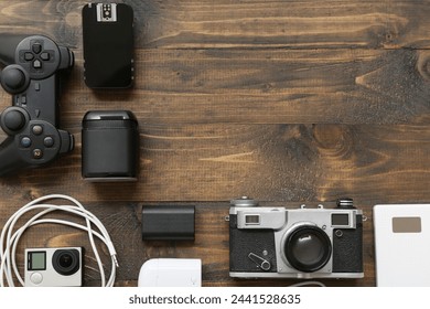 Composition with different modern gadgets on wooden background