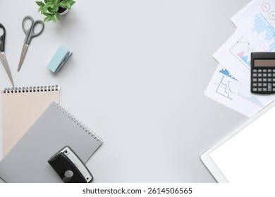 Composition with different stationery, tablet computer and financial documents on grey background