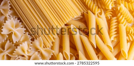 Composition with different tasty uncooked pasta - Italian pasta wallpaper, different types and shapes of pasta layout