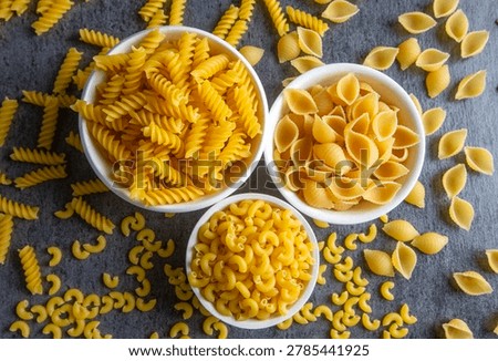 Composition with different tasty uncooked pasta - Italian pasta wallpaper, different types and shapes of pasta layout