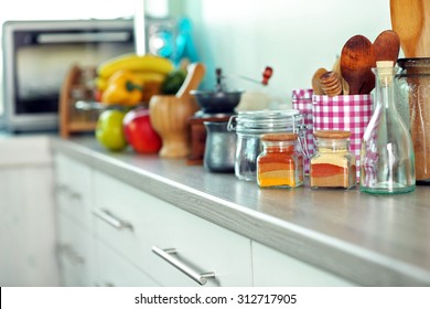 Composition and different utensils wooden wooden table in kitchen