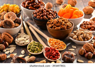 Composition with dried fruits and assorted nuts. - Shutterstock ID 393497851