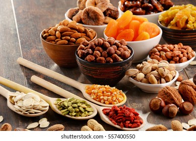 Composition with dried fruits and assorted nuts. - Shutterstock ID 557400550