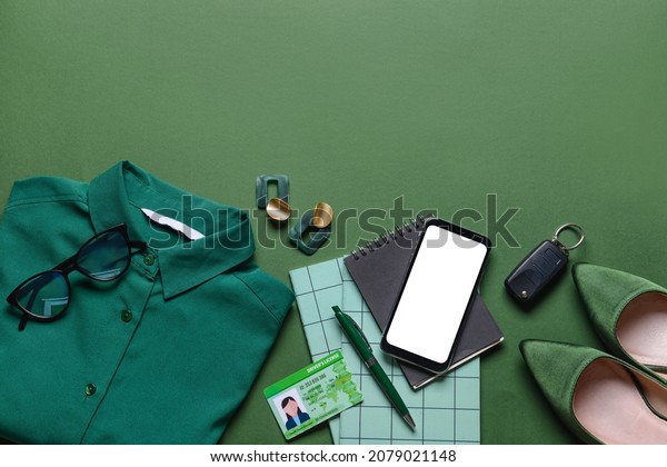 Composition with female accessories and mobile\
phone on color\
background