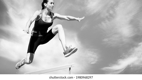 Composition Of Female Hurdle Jumper With Copy Space In Black And White. Sport And Competition Concept Digitally Generated Image.