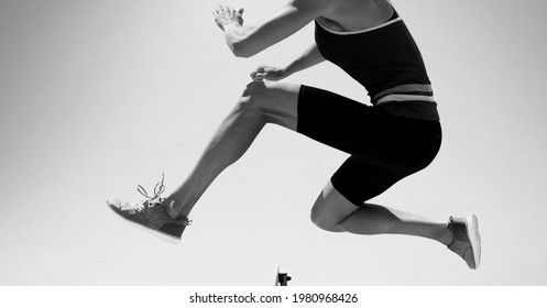 Composition Of Female Hurdle Jumper With Copy Space In Black And White. Sport And Competition Concept Digitally Generated Image.