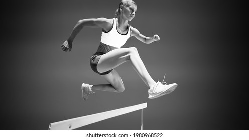 Composition Of Female Hurdle Jumper With Copy Space In Black And White. Sport And Competition Concept Digitally Generated Image.