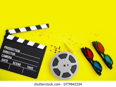 Composition With Film Strip, Clapperboard,  3d Glasses And Confetti Gold Stars On Yellow Background. Concept Movie Night, Cinema. Flatlay. Copy Space. Top View