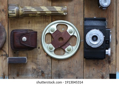 composition flat lay in the style of an alpine chalet, vintage mens items on an old wood table, details