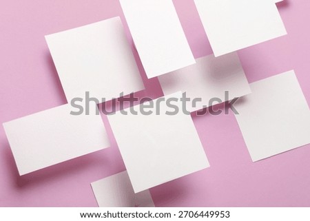 Composition of floating white square memo paper and business cards on pink background. Mockup. Business concept