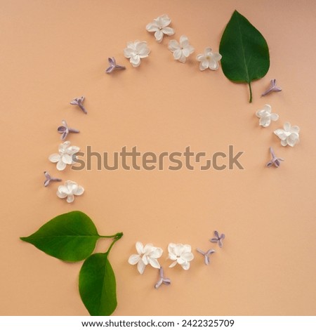 Composition frame made of beautiful spring lilac flowers. Mockup card invitation greeting card postcard copy space template blank. Branches of lilac blooming bouquet