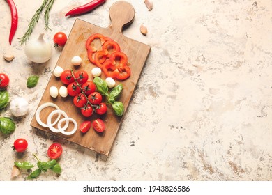 Composition with fresh cherry tomatoes and mozzarella cheese on table - Shutterstock ID 1943826586