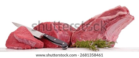 A composition of fresh raw beef meat of different cuts on white background.