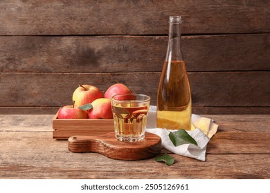 Composition with fruits, wooden tray, bottle and glass of fresh tasty apple cider on wooden background - Powered by Shutterstock