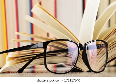 Composition with glasses and books on the table