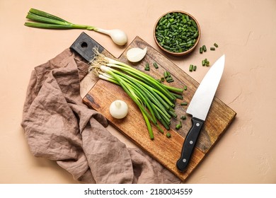 Composition with green onion on color background
