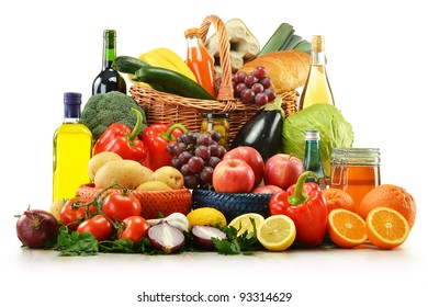 Composition with groceries and basket isolated on white. Vegetables, fruits, wine and bread. - Shutterstock ID 93314629