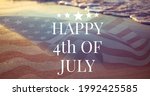 Composition of happy 4th of july text over american flag and sea. united states of america celebration, holiday, patriotism and independence concept digitally generated image.