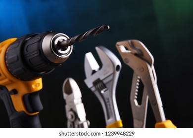 Composition with hardware tools including cordless drill and monkey spanner