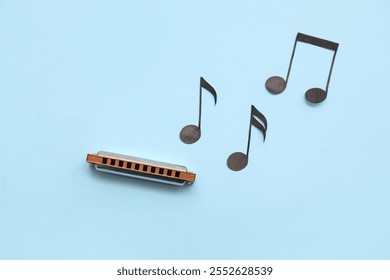 Composition with harmonica and music notes on color background - Powered by Shutterstock